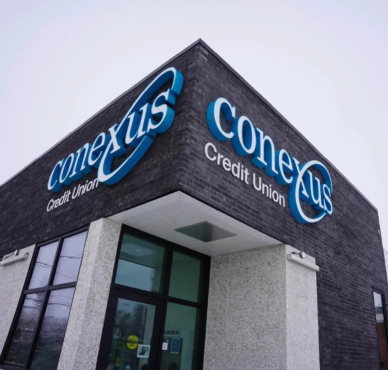 The exterior of a Conexus Credit Union branch.