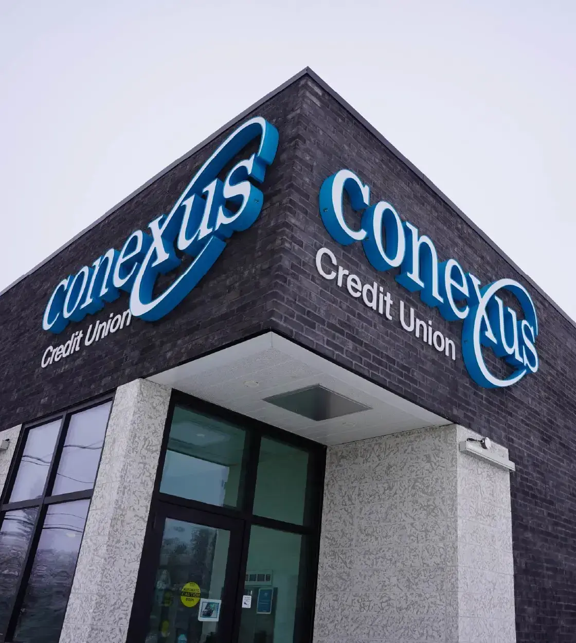 The exterior of a Conexus Credit Union branch.