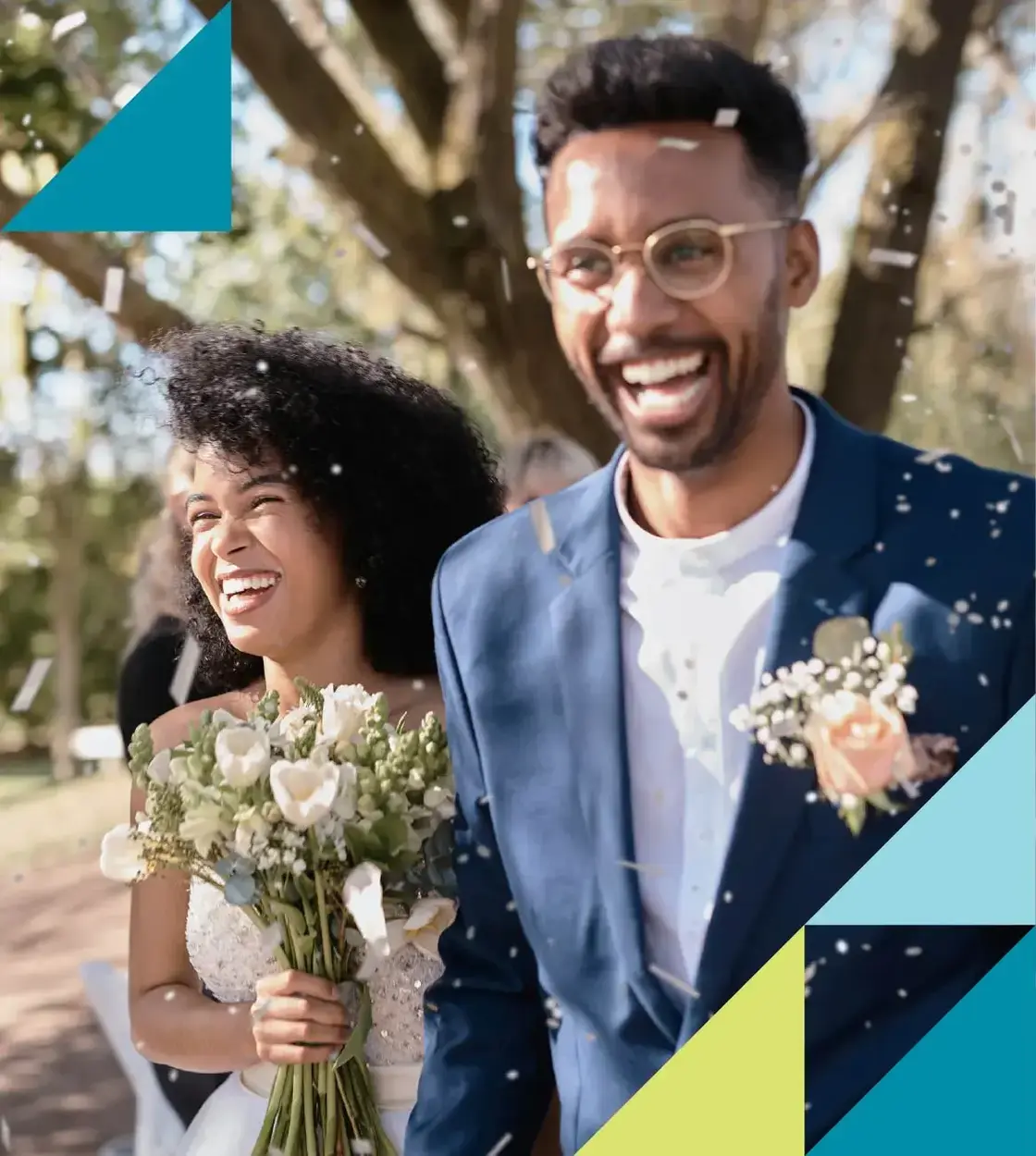 A pair of newlyweds are showered in confetti upon the conclusion of an outdoor wedding ceremony.