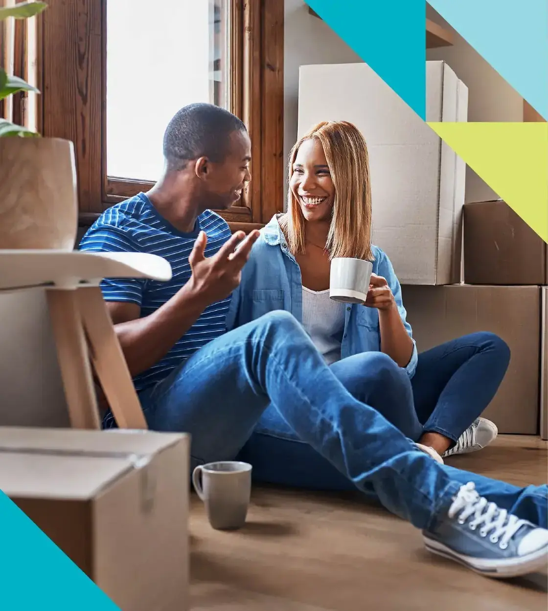 A young couple takes a well-earned coffee break from moving into their new home.